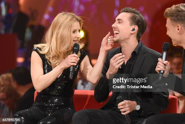 Stefanie Hertel and Sebastian Wurth of the band Feuerherz during the show 'KULTHITS - Die Show mit 100% Livemusik' presented by Kim Fisher at...