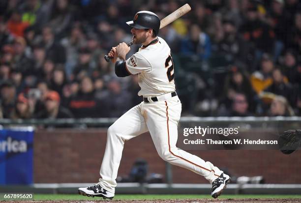 Conor Gillaspie of the San Francisco Giants hits an RBI single, scoring Brandon Belt against the Arizona Diamondbacks in the bottom of the fifth...