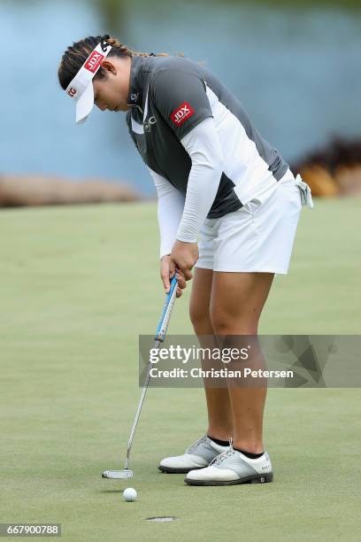 Ariya Jutanugarn of Thailand putts on the eighth green during the first round of the LPGA LOTTE Championship Presented By Hershey at Ko Olina Golf...
