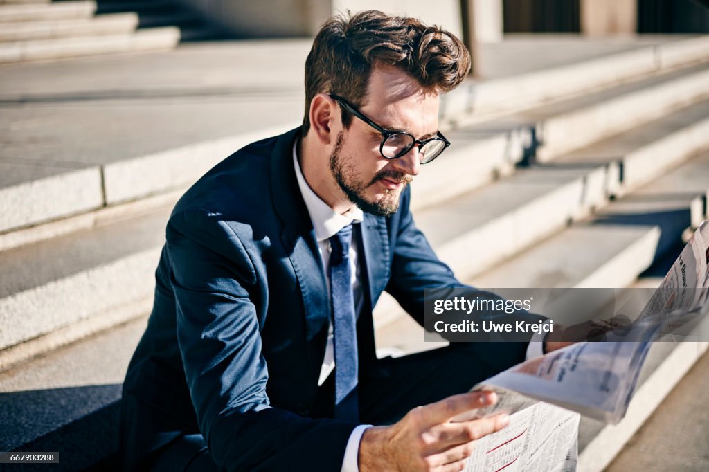 Young businessman talking on phone