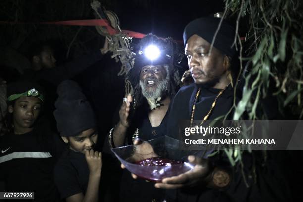 Howshua Amariel , leader of the "Beit Yisrael", sect part of the African Hebrew Israelite Nation of Jerusalem, preforms a prayer after the slaughter...