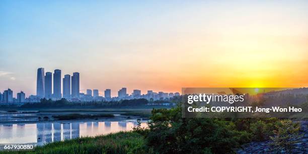 the sunset - songdo ibd stock pictures, royalty-free photos & images