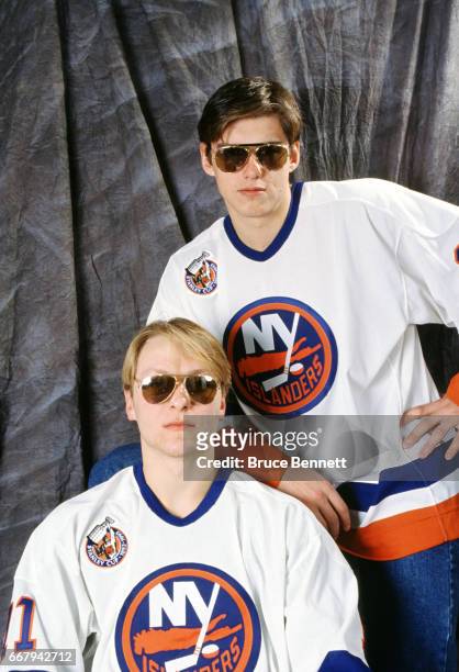 Darius Kasparaitis and Vladimir Malakhov of the New York Islanders pose for a portrait with sunglasses circa April, 1993 at the Nassau Coliseum in...