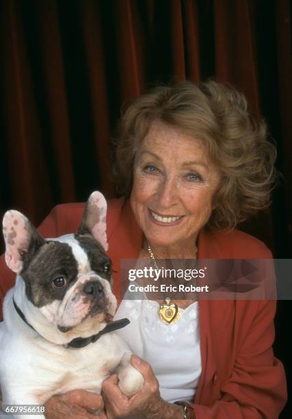 Actress Danielle Darrieux with Her Boston Terrier