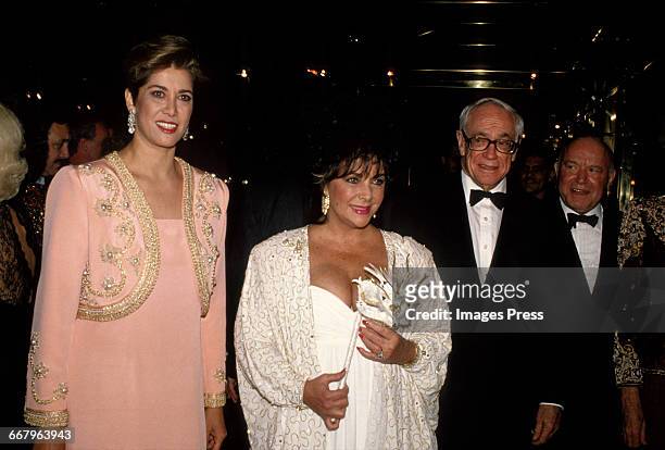 Pat Kluge, Elizabeth Taylor, Malcolm Forbes and John Kluge attend the 1989 Masquerade Ball Benefitting amfAR, The Foundation for AIDS Research at the...
