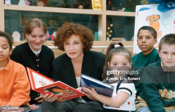 French actress Marlene Jobert reads to children at a hospital in support of the Bayer Sante Foundation. Governed by the Foundation of France, Bayer...