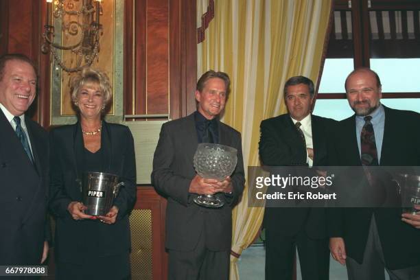 Arnold and Ann Kopelson, Michael Douglas holding Piper-Heidsieck prize, Alain Rouleau and Andrew Davis.