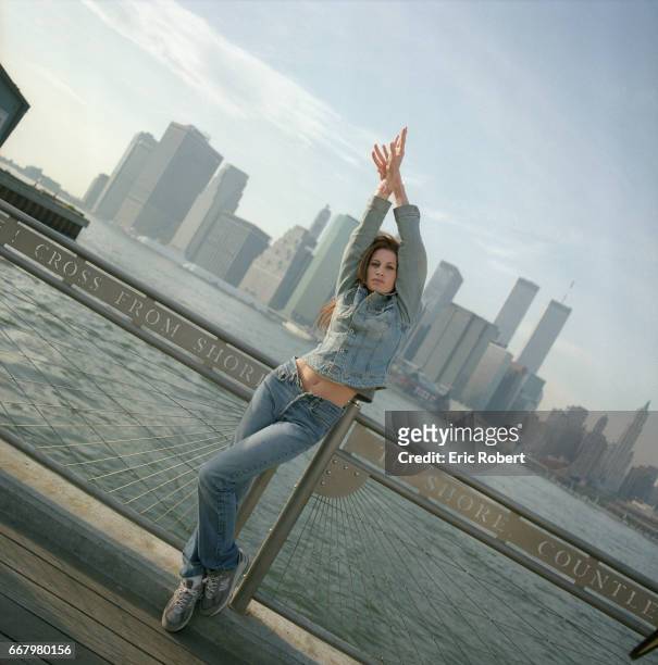 Muriel Amori, an American writer who is popular in France, on the Brooklyn Bridge. She wrote Le Beau Sexe, her first novel, followed by Mode...