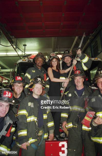 Muriel Amori, an American writer who is popular in France, with a group of New York City firefighters. She wrote Le Beau Sexe, her first novel,...