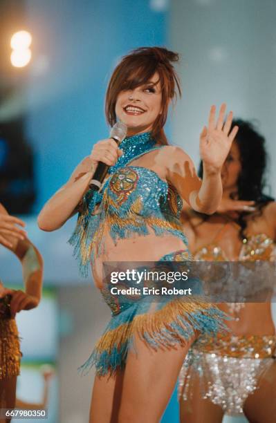 Portugese singer Lio performs on the French television show Tapis Rouge. The show was hosted by popular French celebrity Michel Drucker.