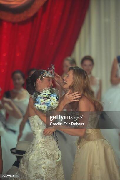 Sophie Thalmann, Miss France 1998, hands on her crown to the winner Mareva Galentier, Miss Tahiti.