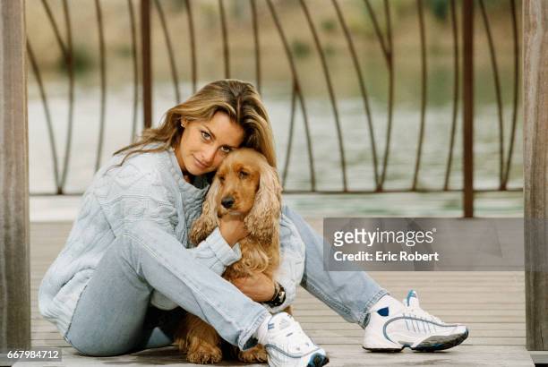 French actress Vanessa Wagner relaxes on the beach in Saint Tropez with her English cocker spaniel. She starred in the French films Le Bal du...