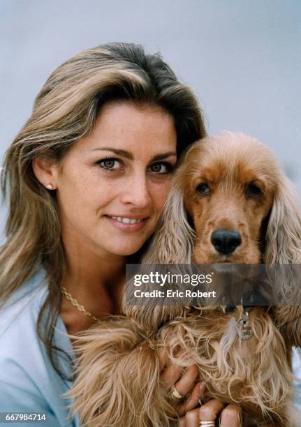 French actress Vanessa Wagner relaxes on the beach in Saint Tropez with her English cocker spaniel. She starred in the French films Le Bal du...