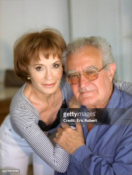 Actress Daniele Evenou sits with her husband, former French minister Georges Fillioud.