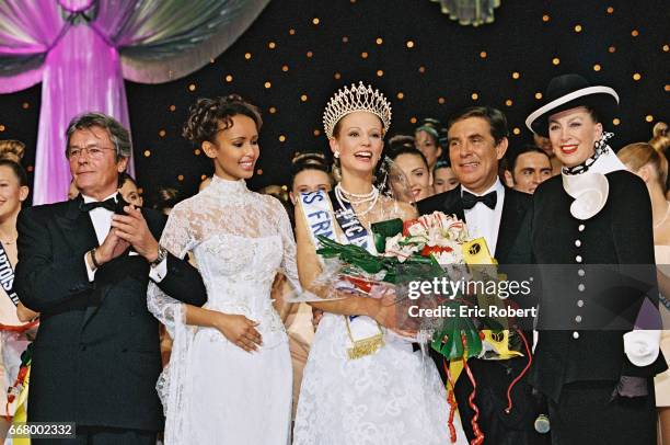 Elodie Gossuin, Miss France 2001, with Sonia Rolla-nd, Mme de Fontenay, Alain Delon the jury preside-nt and Jean-Pierre Foucault.