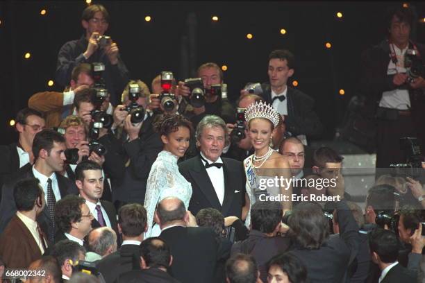Alain Delon, jury president, with Miss France 2000, Sonia Rolland and Miss France 2001, Elodie Gossu-in.