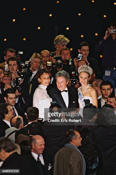 Alain Delon, jury president, with Miss France 2000, Sonia Rolland and Miss France 2001, Elodie Gossu-in.