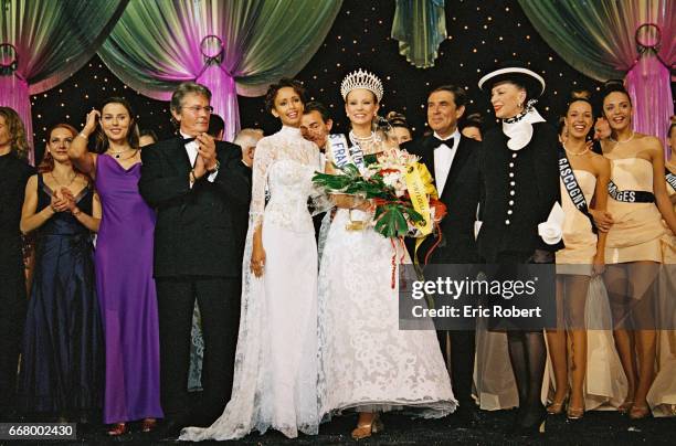Elodie Gossuin, Miss France 2001, with Sonia Rolla-nd, Mme de Fontenay, Alain Delon the jury preside-nt and Jean-Pierre Foucault.