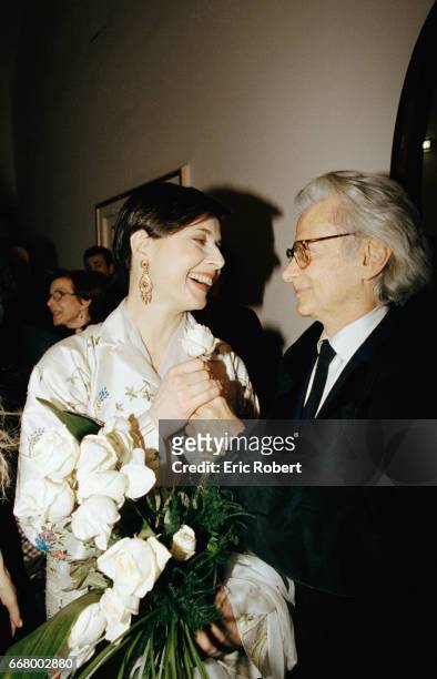 American photographer Richard Avedon gives a rose to actress Isabella Rosselini at the premiere of the operas Oedipus Rex by Igor Stravinsky and Jean...