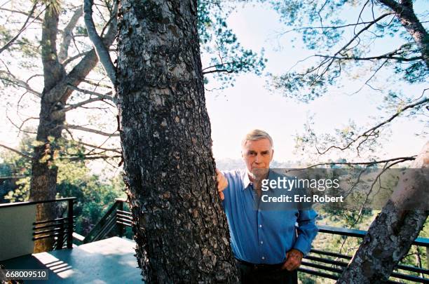 Legendary American actor, Charlton Heston outside on the terrace of his Los Angeles home.