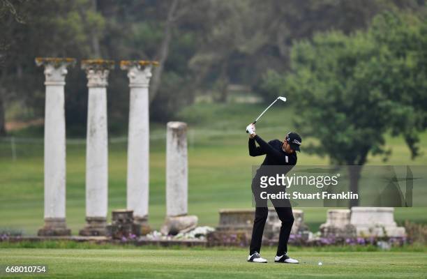 Gregory Bourdy of France plays a shot from the fairway during the first round on day one of the Trophee Hassan II at Royal Golf Dar Es Salam on April...