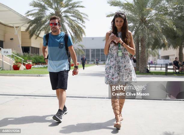 Fernando Alonso of Spain and McLaren Honda walks in the Paddock with girlfriend Linda Morselli during previews to the Bahrain Formula One Grand Prix...