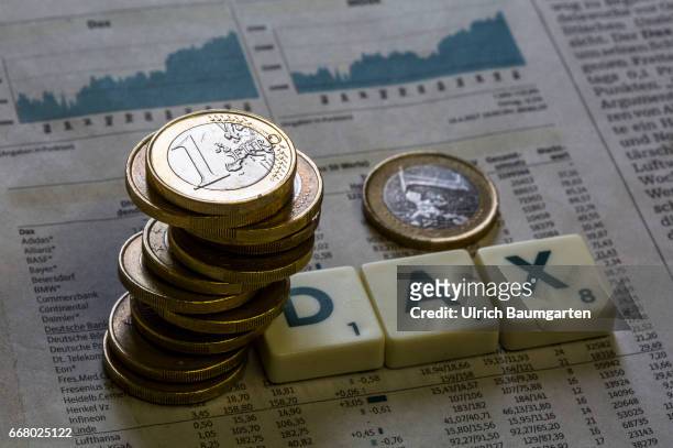 Symbol photo on the topics German stock index, DAX, stock exchange, economy, world economy, etc. The photo shows a stack of euro coins on a DAX rate...