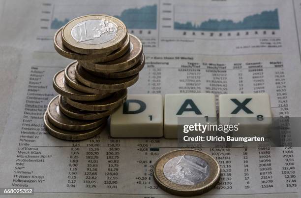 Symbol photo on the topics German stock index, DAX, stock exchange, economy, world economy, etc. The photo shows a stack of euro coins on a DAX rate...