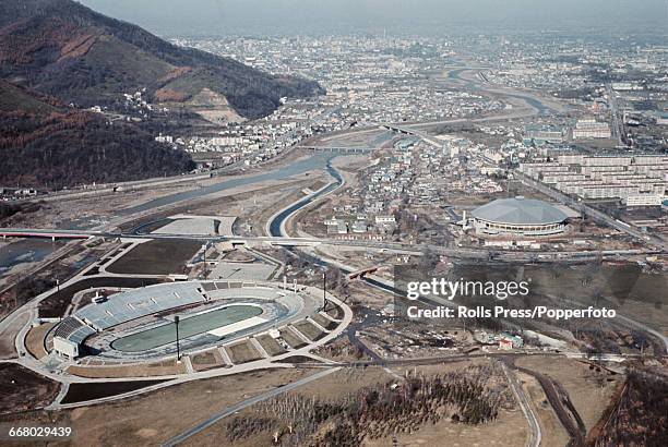 View of Makomanai Park with the Makomanai Ice Arena, Olympic Village and Makomanai Speed Skating Rink under construction in Sapporo, Japan, in...