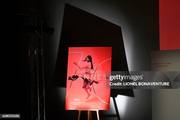 The official poster of the 70th International Cannes Film Festival is pictured during a press conference to announce the movies in official...