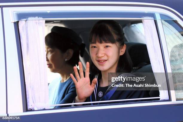 Princess Aiko waves to media reporters on arrival at the Imperial Palace on March 24, 2017 in Tokyo, Japan.