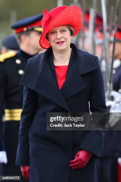 British Prime Minister Theresa May inspects the Officer Cadets during the Sovereign's Parade at Royal Military Academy Sandhurst on April 13, 2017 in...