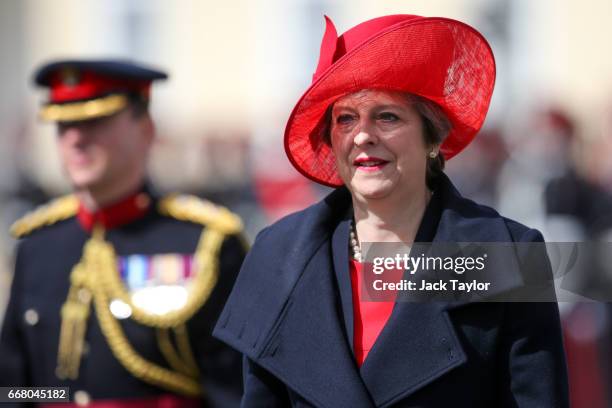 British Prime Minister Theresa May returns after inspecting the Officer Cadets during the Sovereign's Parade at Royal Military Academy Sandhurst on...