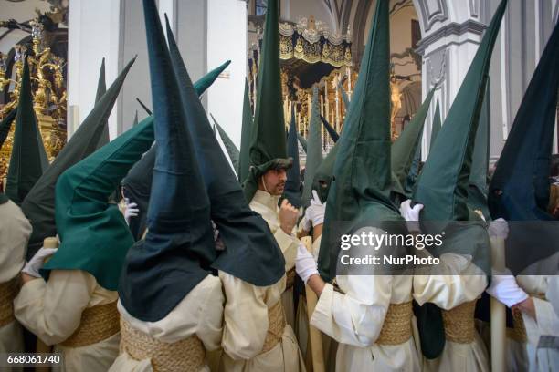 Devotees take part in the 'Domingo de Ramos' procession on April 9, 2017 in Malaga, Spain, during the Holy Week. Seven procesiones came out from...