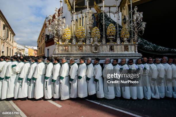 Devotees take part in the 'Domingo de Ramos' procession on April 9, 2017 in Malaga, Spain, during the Holy Week. Seven procesiones came out from...