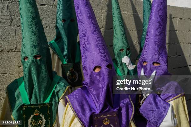 Devotees take part in the 'Domingo de Ramos' procession on April 9, 2017 in Malaga, Spain, during the Holy Week. Seven procesiones came out from...