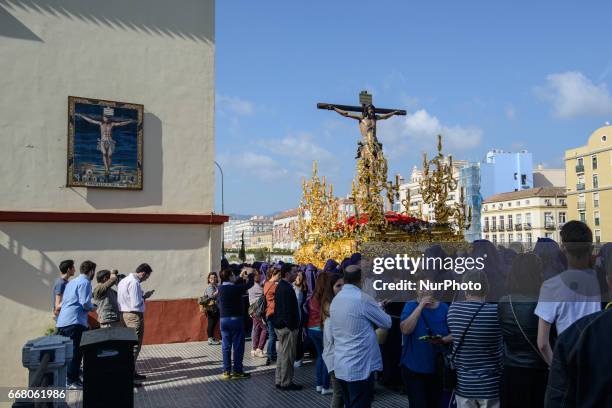 Devotees take part in the 'Domingo de Ramos' procession on April 9, 2017 in Malaga, Spain, during the Holy Week. Seven procesiones came out from...