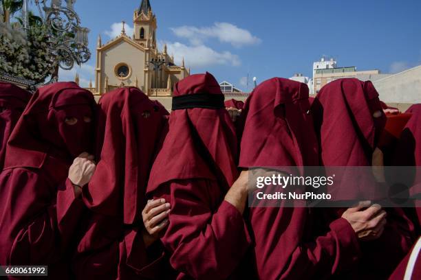 Devotees take part in the 'Domingo de Ramos' procession on April 9, 2017 in Malaga, Spain, during the Holy Week. Seven procesiones came out from...