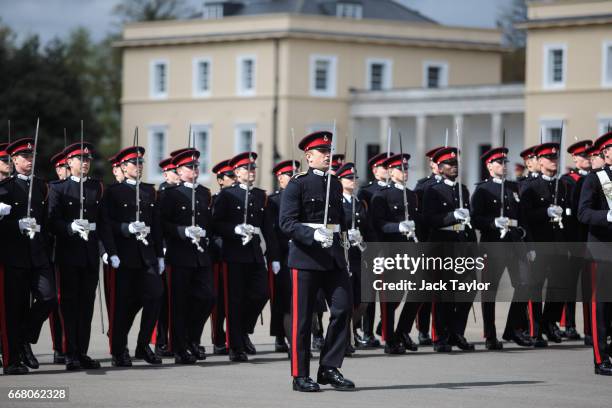 Officer Cadets take part in the Sovereign's Parade at Royal Military Academy Sandhurst on April 13, 2017 in Camberley, England. British Prime...
