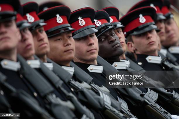 Officer Cadets take part in the Sovereign's Parade at Royal Military Academy Sandhurst on April 13, 2017 in Camberley, England. British Prime...