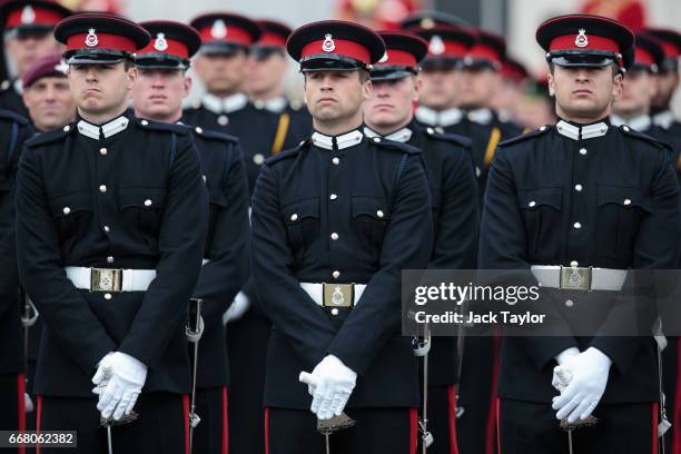 Officer Cadets take part in the Sovereign's Parade at Royal Military Academy Sandhurst on April 13, 2017 in Camberley, England. British Prime...