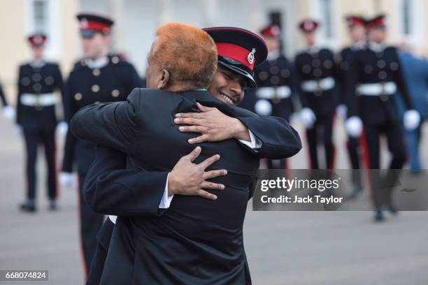 An Officer Cadet embraces a relative after taking part in the Sovereign's Parade at Royal Military Academy Sandhurst on April 13, 2017 in Camberley,...