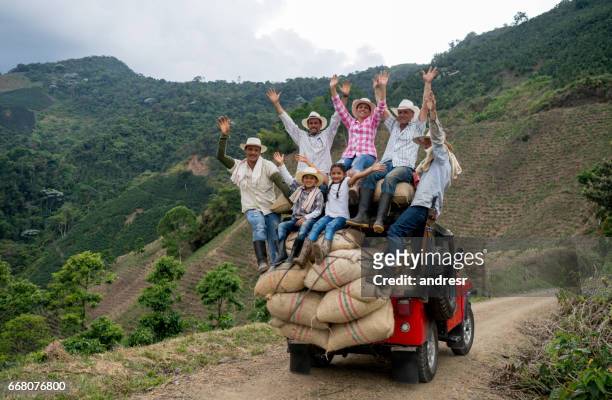 happy group of farmers transporting coffee on a car - colombia stock pictures, royalty-free photos & images