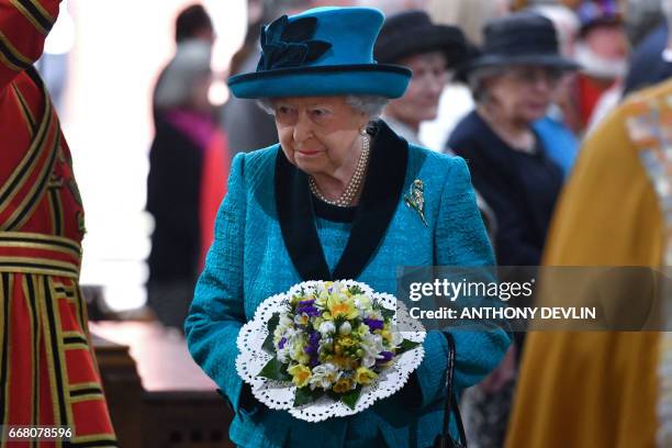 Britain's Queen Elizabeth II attends the Royal Maundy service at Leicester Cathedral on April 13, 2017 in Leicester.