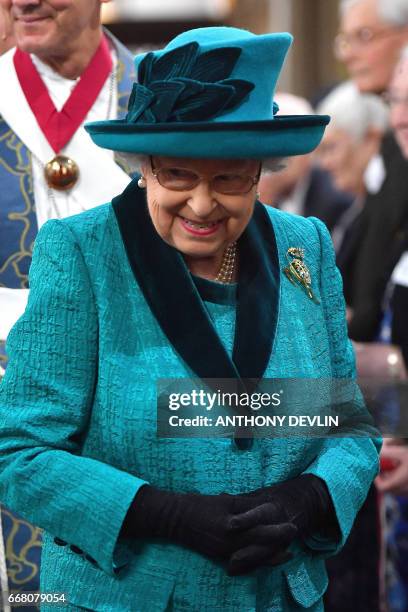 Britain's Queen Elizabeth II attends the Royal Maundy service at Leicester Cathedral on April 13, 2017 in Leicester.