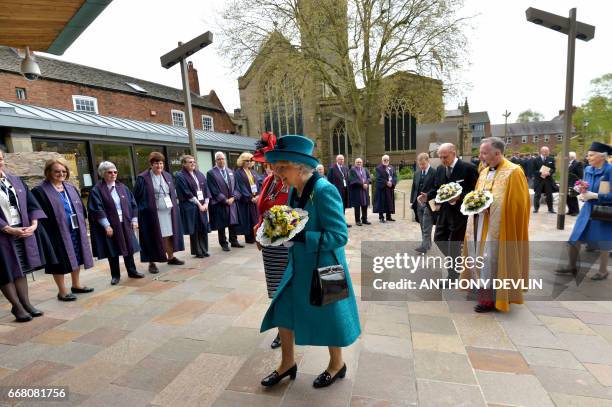 Britain's Queen Elizabeth II leaves following the Royal Maundy service at Leicester Cathedral on April 13, 2017 in Leicester.