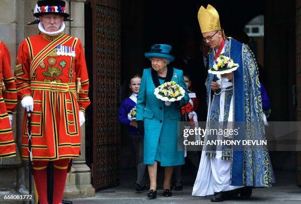 Britain's Queen Elizabeth II leaves following the Royal Maundy service at Leicester Cathedral on April 13, 2017 in Leicester.