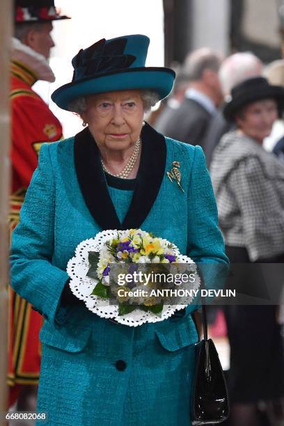 Britain's Queen Elizabeth II attends the Royal Maundy service at Leicester Cathedral on April 13, 2017 in Leicester.