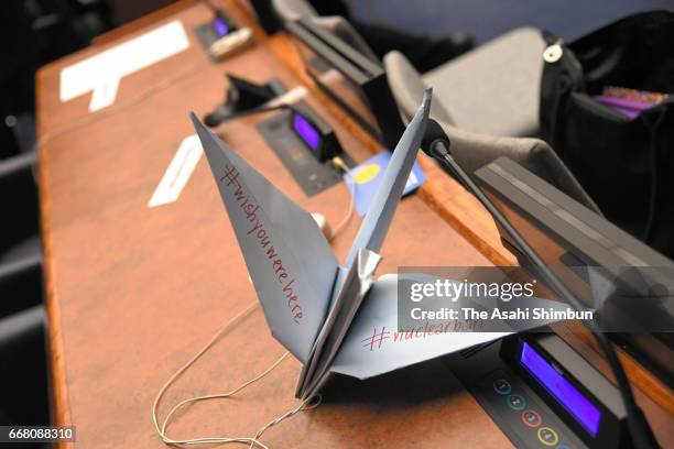 Paper crane is placed at the desk of Japanese delegation after Japan cancelled participation of the nuclear ban treaty discussion at the United...
