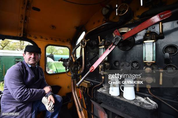 Paul Russell, driver of a 'Q' class locomotive waits for the all clear at Horsted Keynes railway station, a preserved station on the Bluebell Railway...